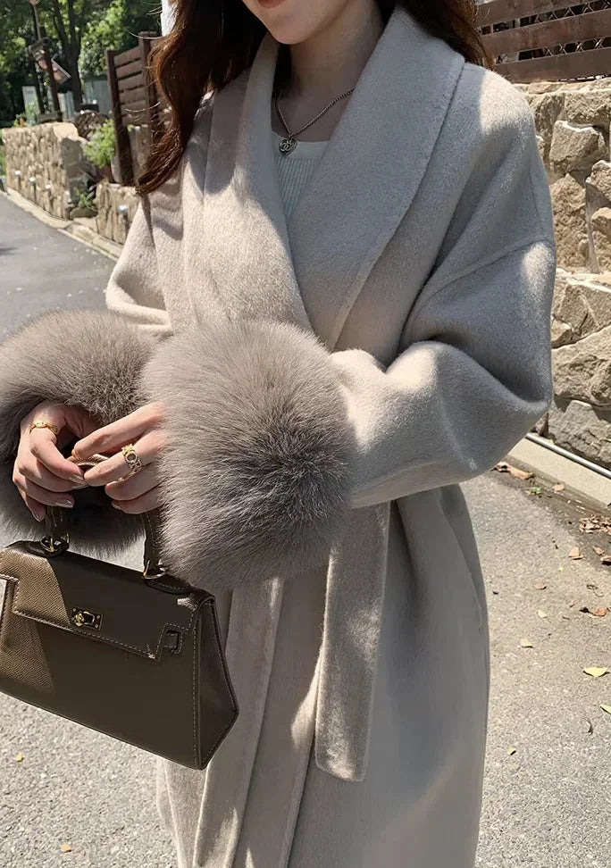 Marta | cappotto lungo con cintura e maniche in pelliccia